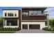 Modern two-story home featuring stone accents, a two-car garage, and mature landscaping at 602 & 604 Channel Dr, Tampa, FL 33606