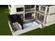 A modern two-story home with a luxury outdoor pool, fireplace, and pergola at 602 & 604 Channel Dr, Tampa, FL 33606