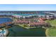 Panoramic aerial view of waterfront residences featuring lush landscaping, water views, and bridge in the distance at 6021 Bahia Del Mar Cir # 238, St Petersburg, FL 33715