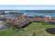 Aerial view showcasing the beautiful waterfront community with residential buildings, lush landscaping, and water views at 6021 Bahia Del Mar Cir # 238, St Petersburg, FL 33715