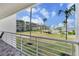 Balcony view overlooking community amenities, green space, and residential buildings for relaxed living at 6021 Bahia Del Mar Cir # 238, St Petersburg, FL 33715