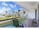 Relaxing balcony with tile floors offering scenic views of lush landscape, bayou, and building at 6021 Bahia Del Mar Cir # 238, St Petersburg, FL 33715