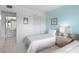 Comfortable bedroom with twin beds and a view into the bathroom at 6021 Bahia Del Mar Cir # 238, St Petersburg, FL 33715
