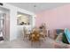 Cozy dining area with a glass table and wicker chairs, connected to the kitchen, offering a relaxed atmosphere at 6021 Bahia Del Mar Cir # 238, St Petersburg, FL 33715