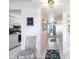 Bright hallway featuring tile flooring and decor, leading to the kitchen and other rooms at 6021 Bahia Del Mar Cir # 238, St Petersburg, FL 33715