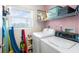 Functional laundry room featuring a washer and dryer and shelving for storage at 6021 Bahia Del Mar Cir # 238, St Petersburg, FL 33715