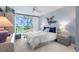 Bright bedroom with balcony access showcases water views, offering a serene and relaxing retreat at 6021 Bahia Del Mar Cir # 238, St Petersburg, FL 33715