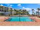 Sparkling pool surrounded by lounge chairs and lush landscaping, perfect for relaxation and enjoying the Florida sunshine at 6021 Bahia Del Mar Cir # 238, St Petersburg, FL 33715