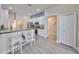 Bright kitchen with white cabinetry, granite countertops, stainless steel appliances and modern breakfast bar at 6107 Heroncrest Ct, Lithia, FL 33547