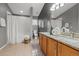 Bathroom featuring double vanities, granite counters, neutral tile flooring, and a shower/tub combo at 624 51St N Ave, St Petersburg, FL 33703