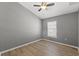 Cozy bedroom featuring natural light and wood-look flooring, ideal for relaxation at 624 51St N Ave, St Petersburg, FL 33703