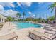 Community pool with several chairs, tables, and tropical landscaping at 624 51St N Ave, St Petersburg, FL 33703