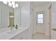 Bathroom vanity featuring a white quartz countertop and a walkout door to exterior at 6332 35Th Avenue E Cir, Palmetto, FL 34221