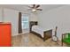 Simple bedroom with wood floors, a comfortable bed, and a window with natural light at 6332 35Th Avenue E Cir, Palmetto, FL 34221