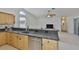 Updated kitchen featuring granite countertops, stainless steel appliances, and access to the dining and living areas at 6332 35Th Avenue E Cir, Palmetto, FL 34221