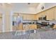 Kitchen featuring granite countertops, stainless steel appliances, and wood cabinetry at 6332 35Th Avenue E Cir, Palmetto, FL 34221