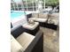 Relaxing outdoor living area featuring patio furniture, a pool, and a dining set for six at 6332 35Th Avenue E Cir, Palmetto, FL 34221