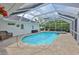 A screened-in pool and spa combination offer a relaxing outdoor retreat at 6332 35Th Avenue E Cir, Palmetto, FL 34221