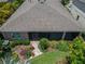 Overhead view of the backyard highlighting a tiled patio entrance and colorful landscaping around the home at 6507 Maiden Sea Dr, Apollo Beach, FL 33572