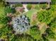 Aerial view showcasing the home's lush backyard with mature trees and well-manicured landscaping at 6507 Maiden Sea Dr, Apollo Beach, FL 33572