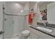 Bright bathroom with glass-enclosed shower, granite countertop vanity, and modern fixtures at 6507 Maiden Sea Dr, Apollo Beach, FL 33572