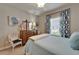 Relaxing bedroom with a four-poster bed and ceiling fan, featuring a soft color palette at 6507 Maiden Sea Dr, Apollo Beach, FL 33572
