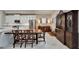 Dining area features a wooden table with chairs and a large cabinet at 6507 Maiden Sea Dr, Apollo Beach, FL 33572