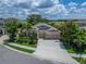 A beautiful one-story home showcasing a three car garage, well manicured landscaping, and situated in a wonderful neighborhood at 6507 Maiden Sea Dr, Apollo Beach, FL 33572