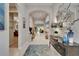 Elegant hallway with arched doorways, tasteful decor, and tiled flooring throughout at 6507 Maiden Sea Dr, Apollo Beach, FL 33572