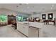 Open concept kitchen with large island, stainless steel appliances and abundant natural light at 6507 Maiden Sea Dr, Apollo Beach, FL 33572