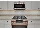 Close-up of kitchen featuring stainless steel appliances and granite countertops at 6507 Maiden Sea Dr, Apollo Beach, FL 33572