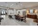 Bright kitchen with white cabinetry, large island with seating, and stainless steel appliances at 6507 Maiden Sea Dr, Apollo Beach, FL 33572