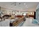 Spacious living room features elegant furnishings, piano, and ample natural light at 6507 Maiden Sea Dr, Apollo Beach, FL 33572