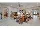 Expansive living room with a fireplace, tv, comfortable seating, and elegant decor at 6507 Maiden Sea Dr, Apollo Beach, FL 33572