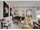 Elegant living space with a piano, arched doorways, and tasteful decor throughout at 6507 Maiden Sea Dr, Apollo Beach, FL 33572