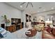Comfortable living room featuring stylish furnishings, a large TV, and elegant decor at 6507 Maiden Sea Dr, Apollo Beach, FL 33572