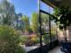 Relaxing screened patio offers serene views of the colorful landscaped garden and lush greenery, creating a peaceful outdoor space at 6507 Maiden Sea Dr, Apollo Beach, FL 33572