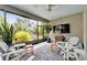 Screened porch offers serene outdoor seating with views of lush landscaping at 6507 Maiden Sea Dr, Apollo Beach, FL 33572