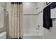 Bathroom shower featuring white subway tiles, rainfall shower head, and shower curtain at 6507 Maiden Sea Dr, Apollo Beach, FL 33572
