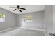This bedroom has tile floors, a ceiling fan, and a window at 6601 13Th N St, St Petersburg, FL 33702
