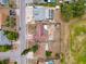 A bird's-eye view of a single-Gathering home with a spacious fenced backyard in a quiet residential neighborhood at 7237 Bramblewood Dr, Port Richey, FL 34668