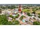 An aerial view shows a single-Gathering home in a quiet neighborhood near green spaces, perfect for suburban living at 7237 Bramblewood Dr, Port Richey, FL 34668