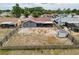 A high angle view shows a spacious backyard with a fire pit, shed, and screened patio, great for entertaining at 7237 Bramblewood Dr, Port Richey, FL 34668