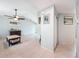 Open-concept living room with tile flooring and neutral paint, providing a welcoming atmosphere at 7237 Bramblewood Dr, Port Richey, FL 34668