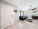 Bright living room featuring tile floors, a ceiling fan, and a comfortable seating area at 7237 Bramblewood Dr, Port Richey, FL 34668