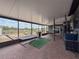 Covered patio with a hammock, grill, furniture set, dartboard, fridge and an entertainment area at 7237 Bramblewood Dr, Port Richey, FL 34668