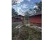 Exterior of the detached garage and back of home in the backyard at 7807 N Mulberry St, Tampa, FL 33604