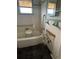 Bathroom with white tiles and damaged wall at 7807 N Mulberry St, Tampa, FL 33604