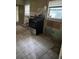 A kitchen showcasing the oven against the wall and a floor with tile at 7807 N Mulberry St, Tampa, FL 33604