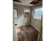 Empty room with damaged floors and walls at 7807 N Mulberry St, Tampa, FL 33604
